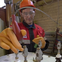 Electrician Rival Mavletkulov performs incoming inspection of a new transformer.